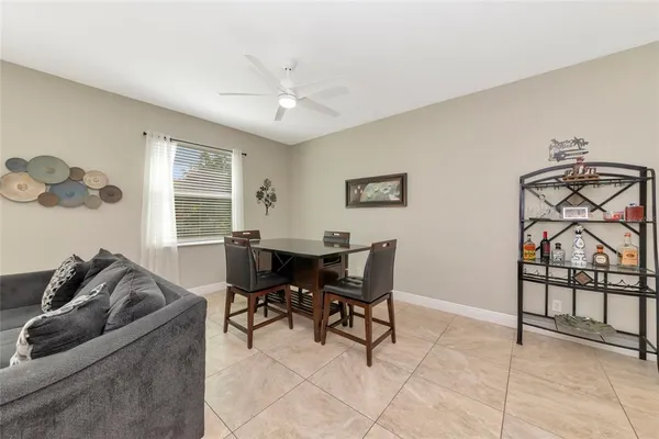a view of a livingroom with furniture and a window
