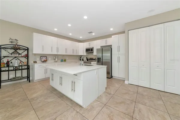 a kitchen with stainless steel appliances granite countertop a sink and cabinets