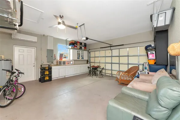 a view of a livingroom with furniture and a ceiling fan