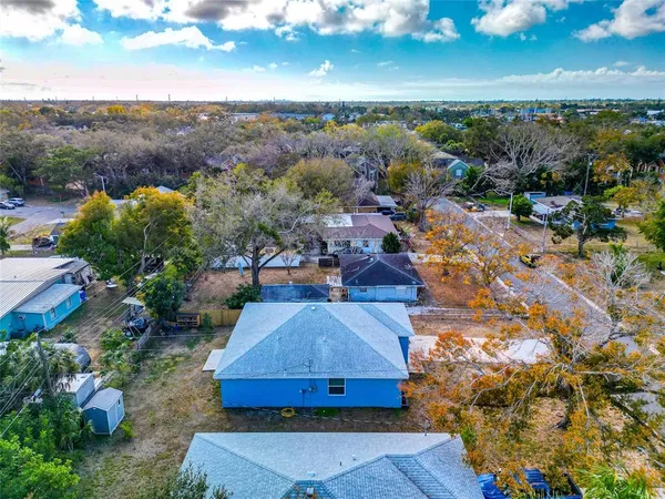 an aerial view of residential houses and lake view