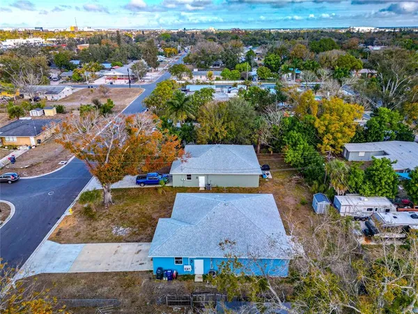 an aerial view of residential houses with outdoor space