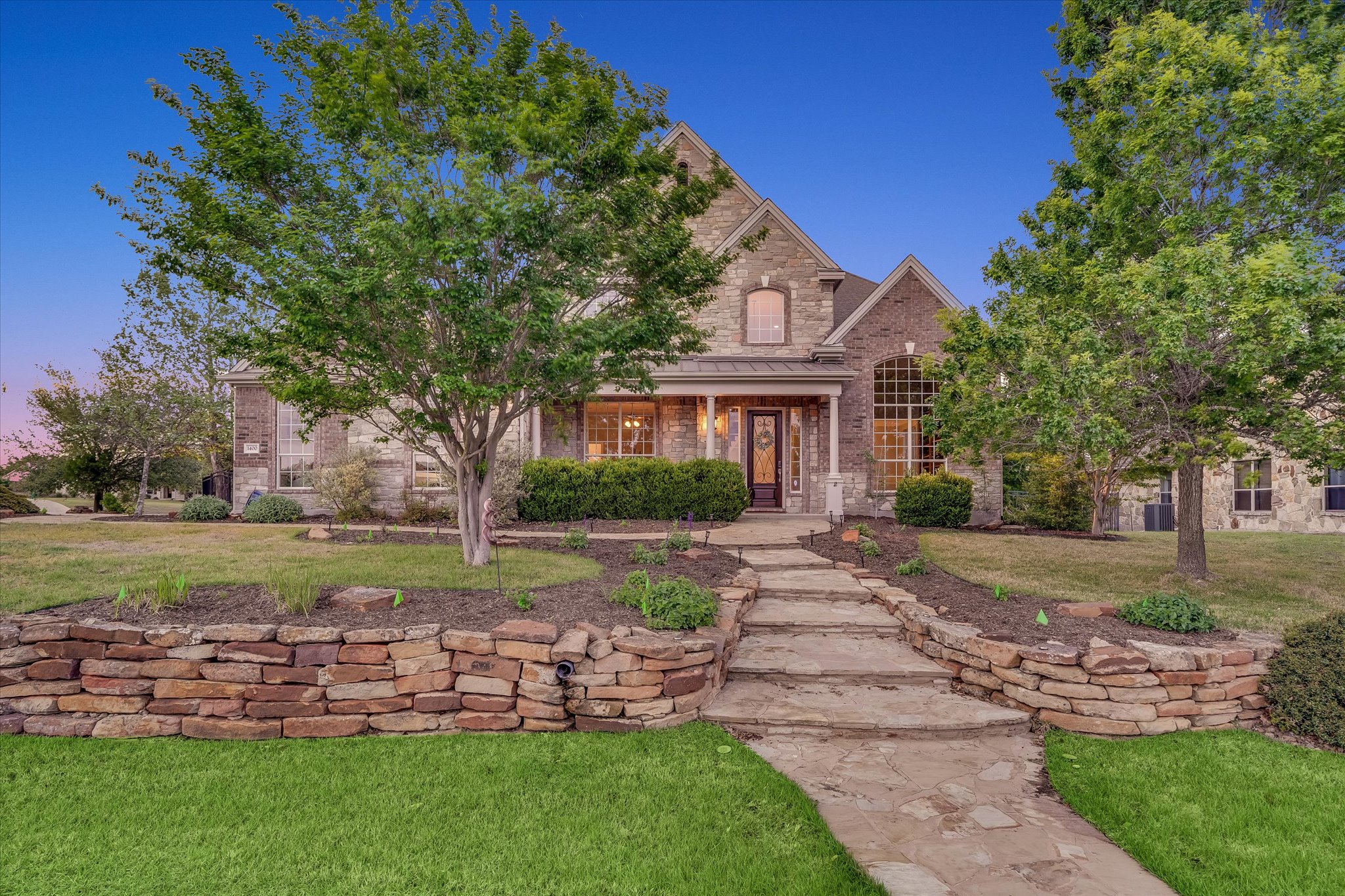 1400 Tom Sawyer Road Austin, TX 78737 - Photo 2 of 40 Inviting entry with mature landscaping on a spacious 1.2+ acre lot in Sawyer Ranch.