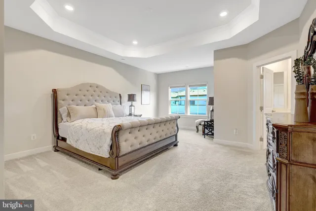 a bed room with a bed and a television