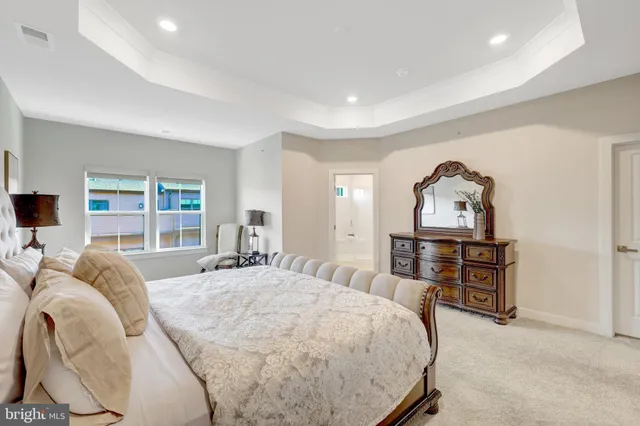 a view of walk in closet with clothes