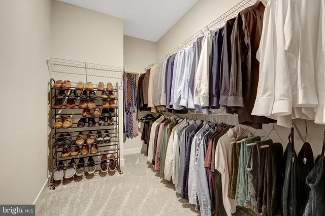 a bathroom with a shower a sink and a mirror