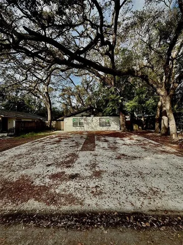 a view of outdoor space with deck and tree