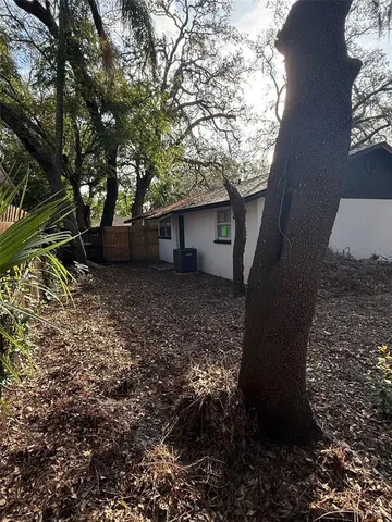 a view of a house with a tree
