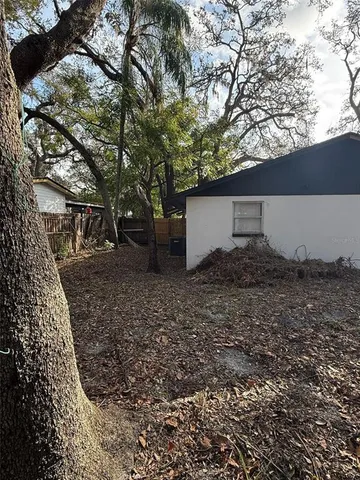 a backyard of a house with lots of green space