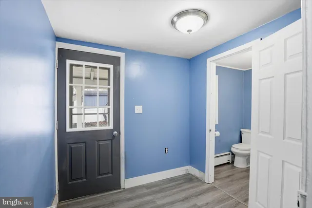 a bathroom with a toilet and a sink