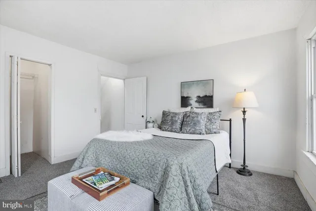a bathroom with a shower and a glass door