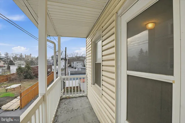 a view of empty room with a fireplace