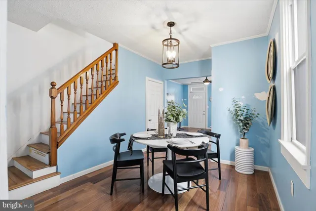 a kitchen with stainless steel appliances kitchen island granite countertop a sink stove and refrigerator