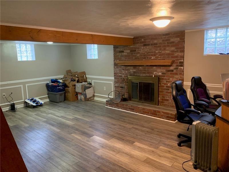 206 Bonnie Street Rostraver Township, PA 15012 - Photo 13 of 26 a living room with furniture and a fireplace