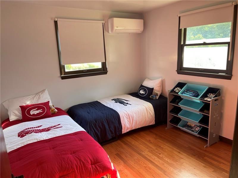 206 Bonnie Street Rostraver Township, PA 15012 - Photo 20 of 26 a bedroom with two beds and a window