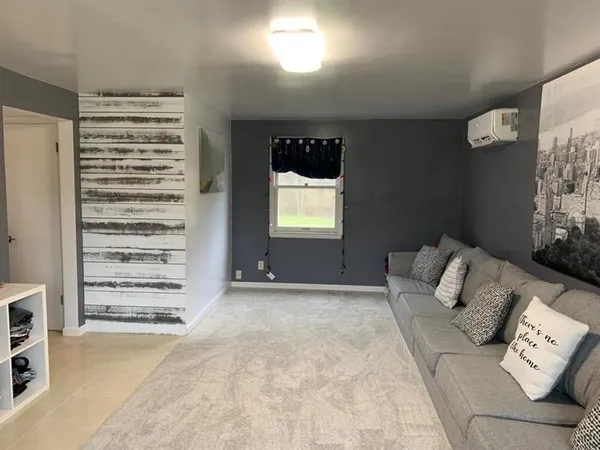 a view of house with a yard