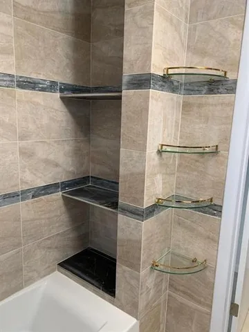 a kitchen with a stove a sink and a refrigerator