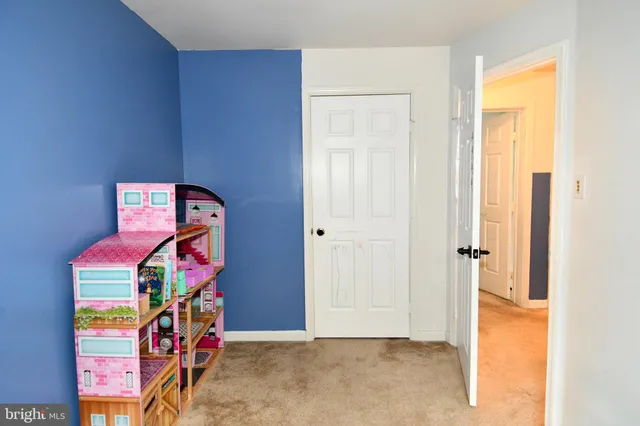 a bedroom with a large bed and a large window