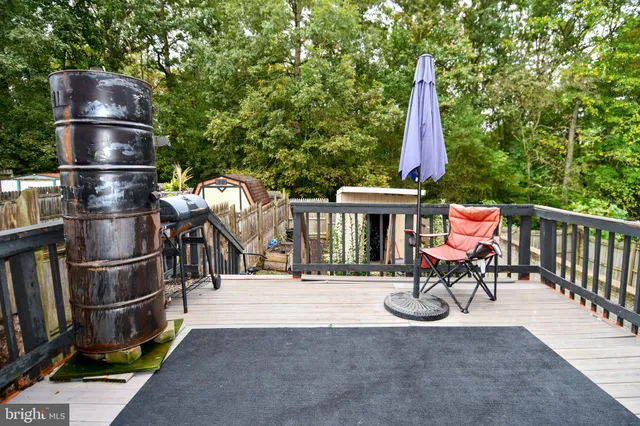 a view of a balcony with two chairs and a table