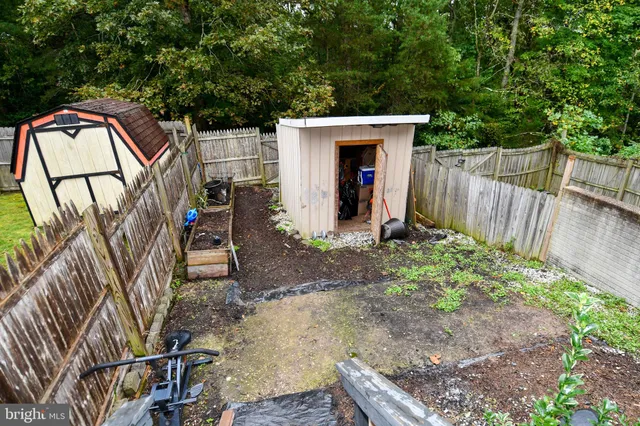 a view of a house with wooden deck