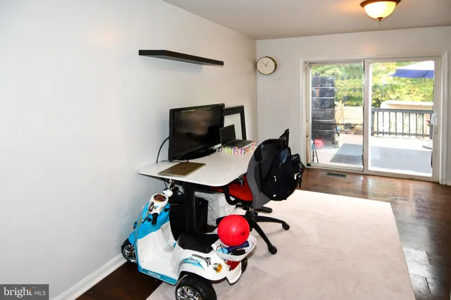 a room with toys and wooden floor