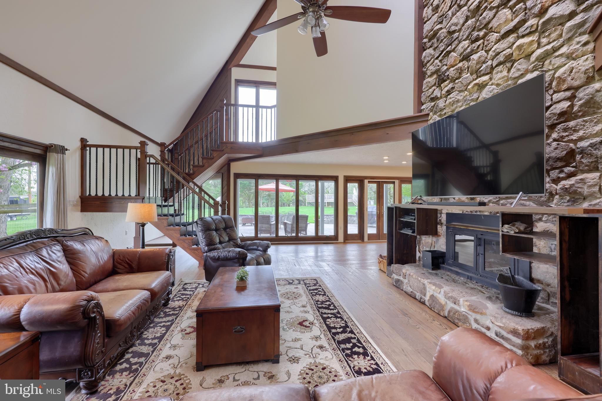 15 Dead End Road Lititz, PA 17543 - Photo 13 of 49 a living room with furniture a fireplace and a flat screen tv