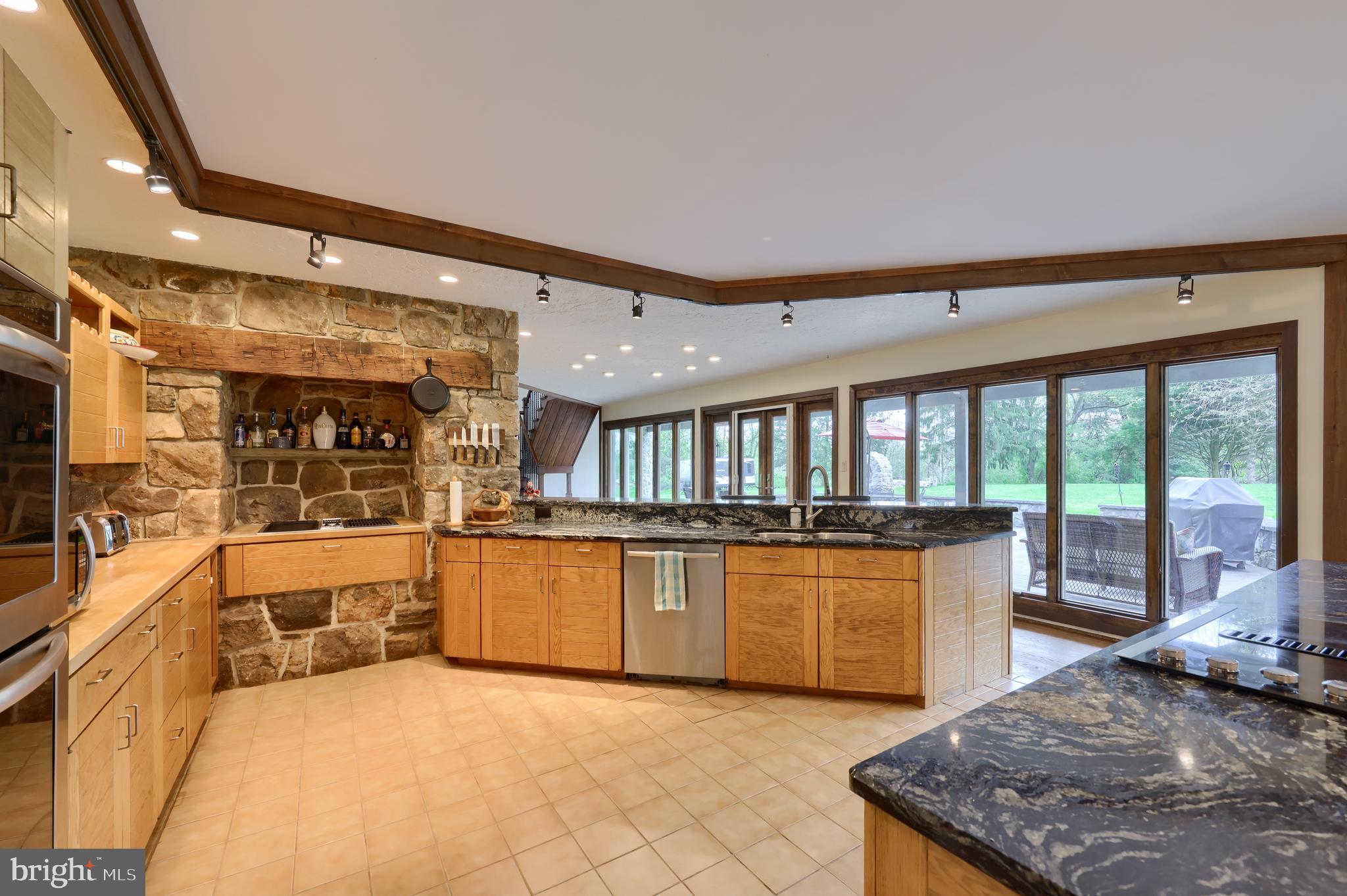 15 Dead End Road Lititz, PA 17543 - Photo 16 of 49 a large kitchen with stainless steel appliances granite countertop a large window and a counter top space