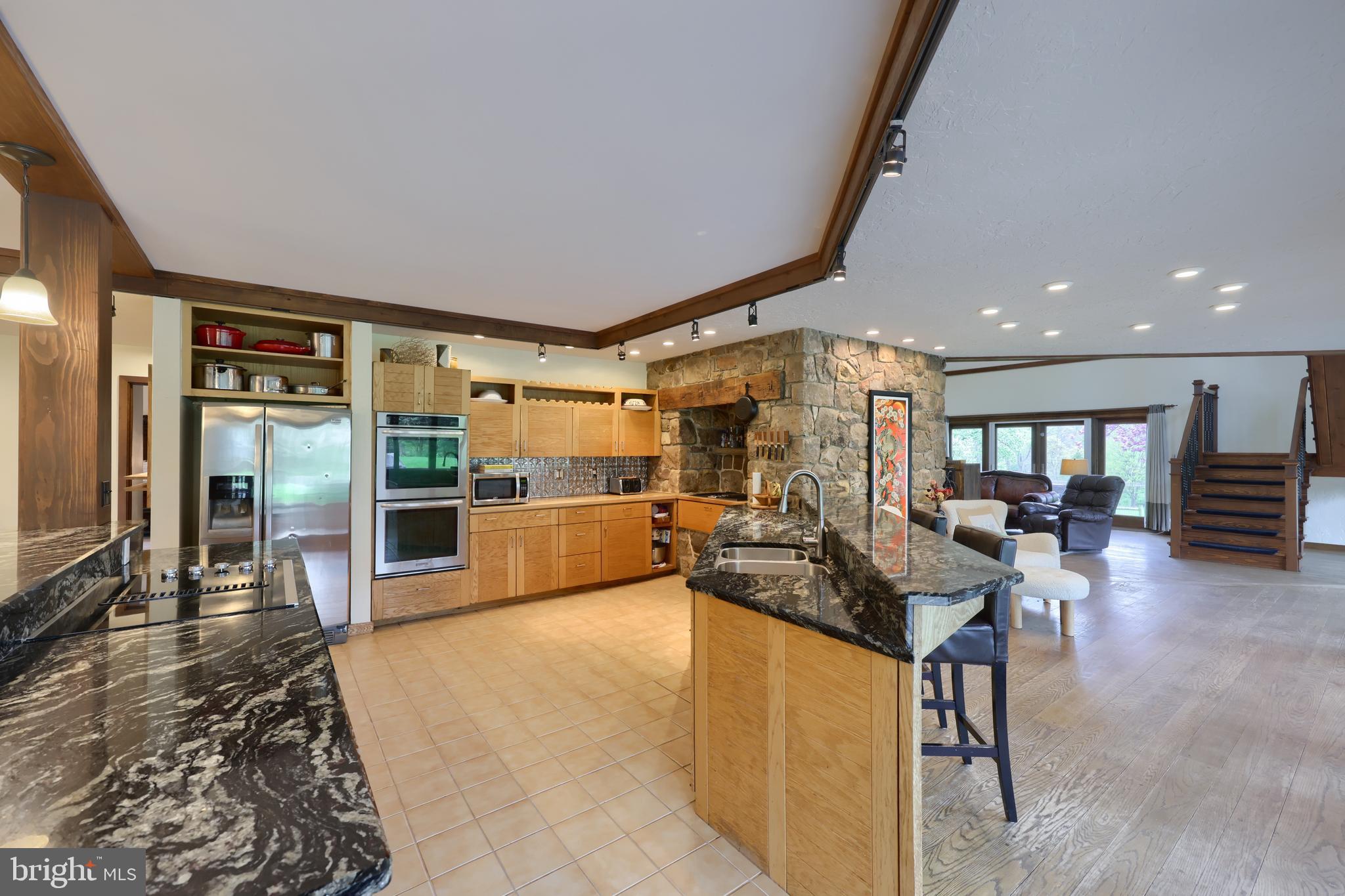 15 Dead End Road Lititz, PA 17543 - Photo 17 of 49 a living room with couches and kitchen view with wooden floor