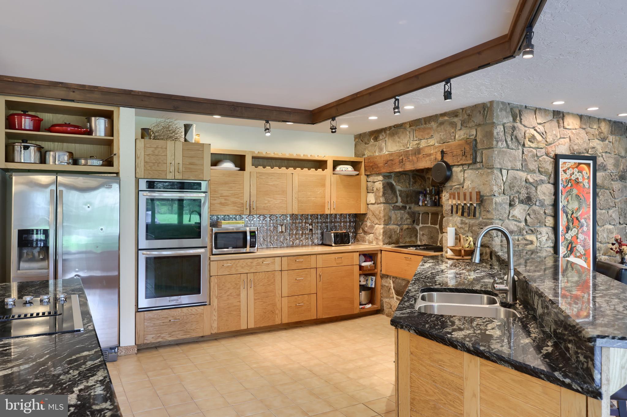 15 Dead End Road Lititz, PA 17543 - Photo 18 of 49 a kitchen with stainless steel appliances granite countertop a stove and a refrigerator