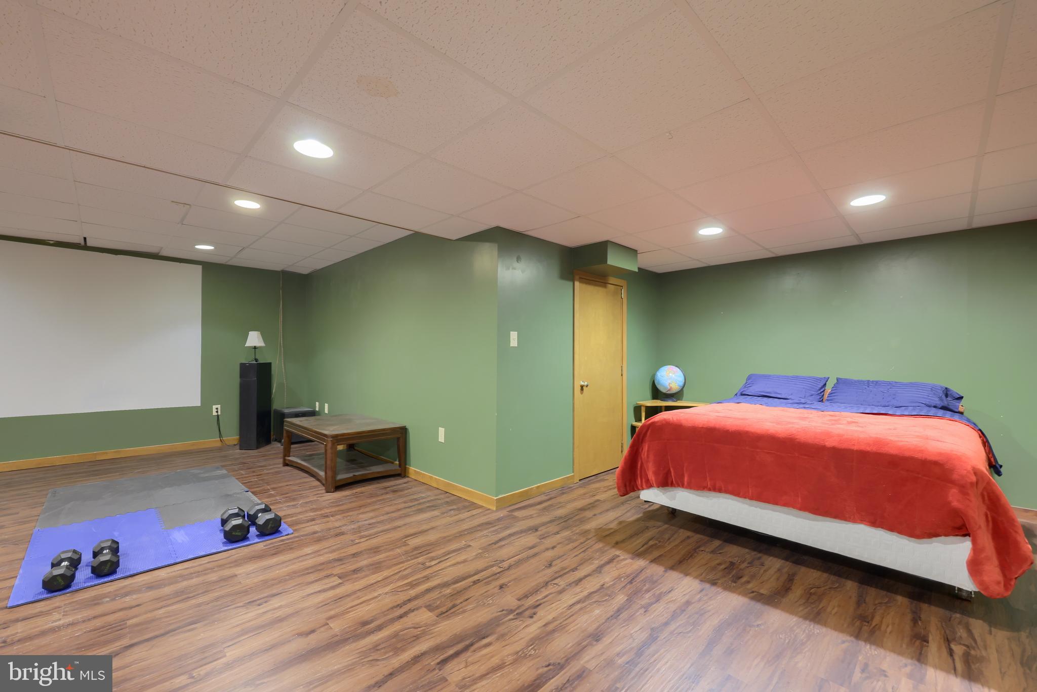 15 Dead End Road Lititz, PA 17543 - Photo 38 of 49 a bedroom with a bed and a chandelier