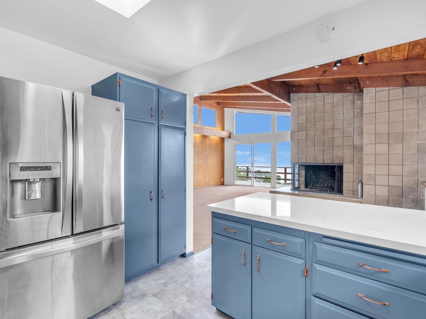 224 Olympian Way Pacifica, CA 94044 - Photo 13 of 46 a kitchen with a refrigerator and a sink
