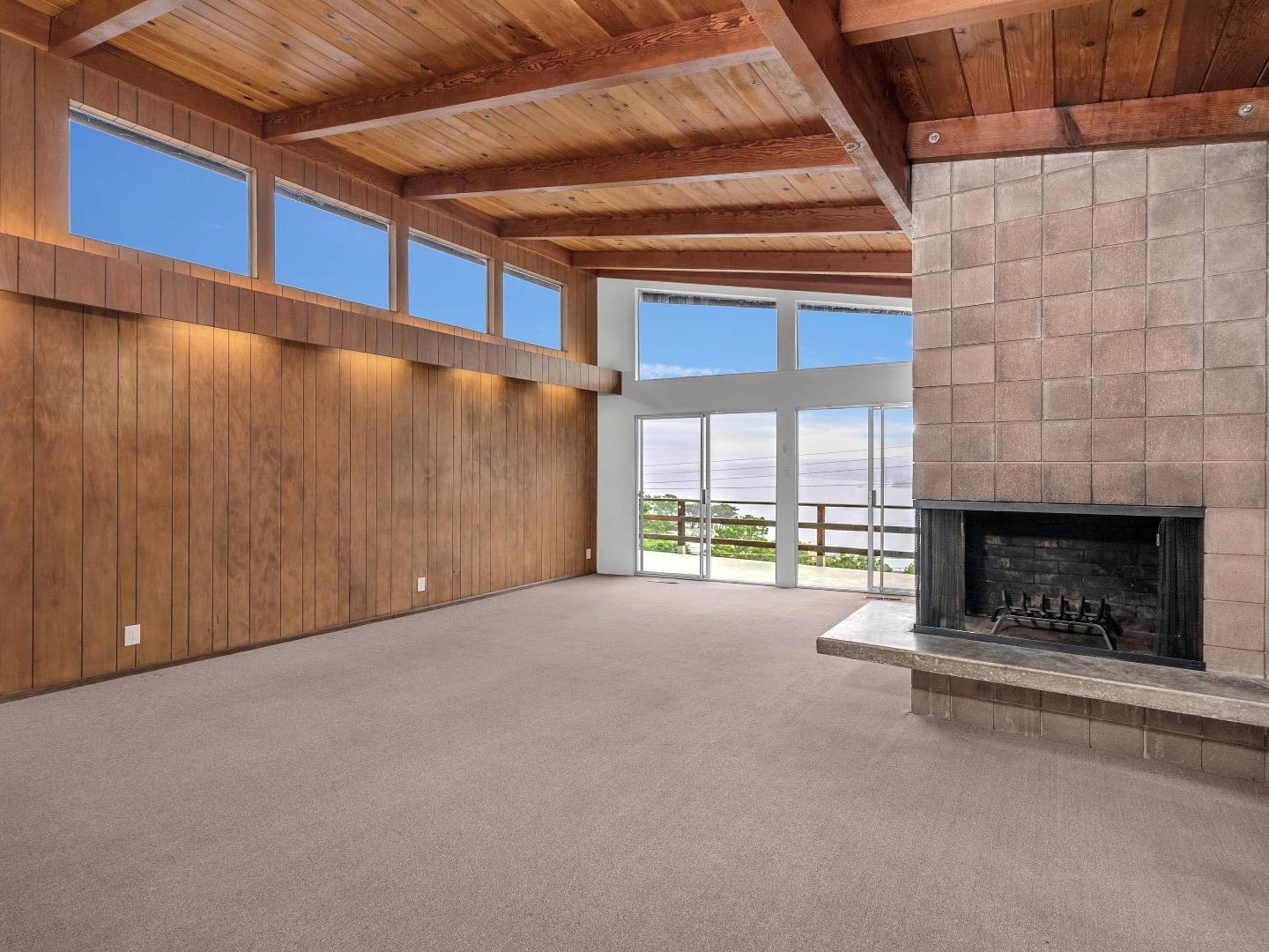 224 Olympian Way Pacifica, CA 94044 - Photo 17 of 46 a view of a room with a fireplace and window