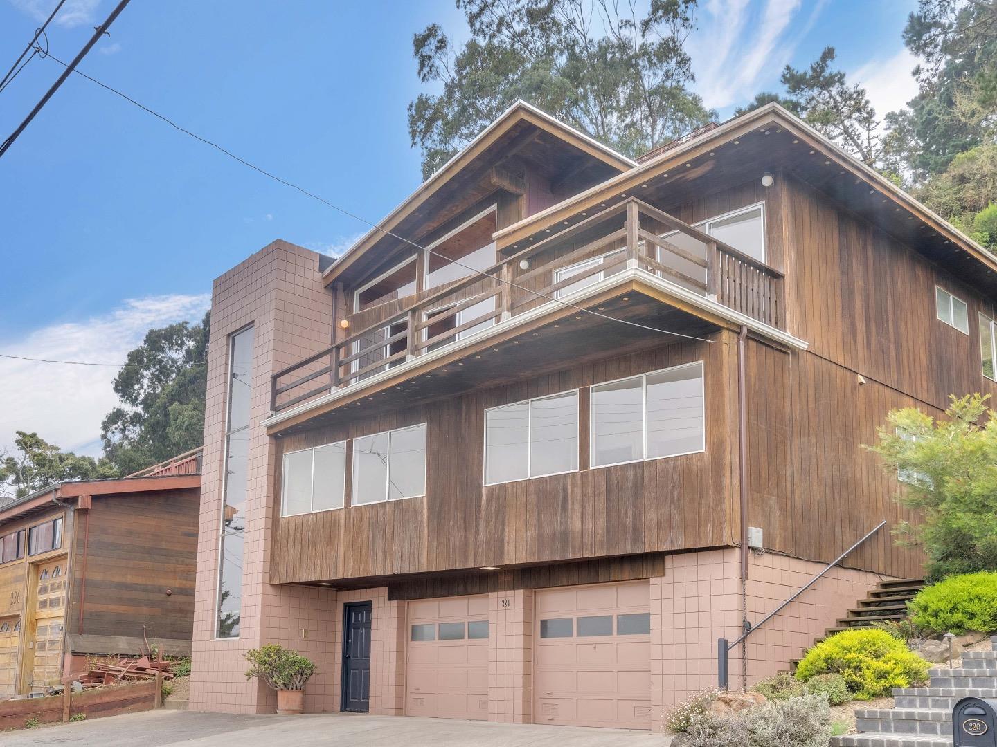 224 Olympian Way Pacifica, CA 94044 - Photo 2 of 46 a view of a building with a small yard