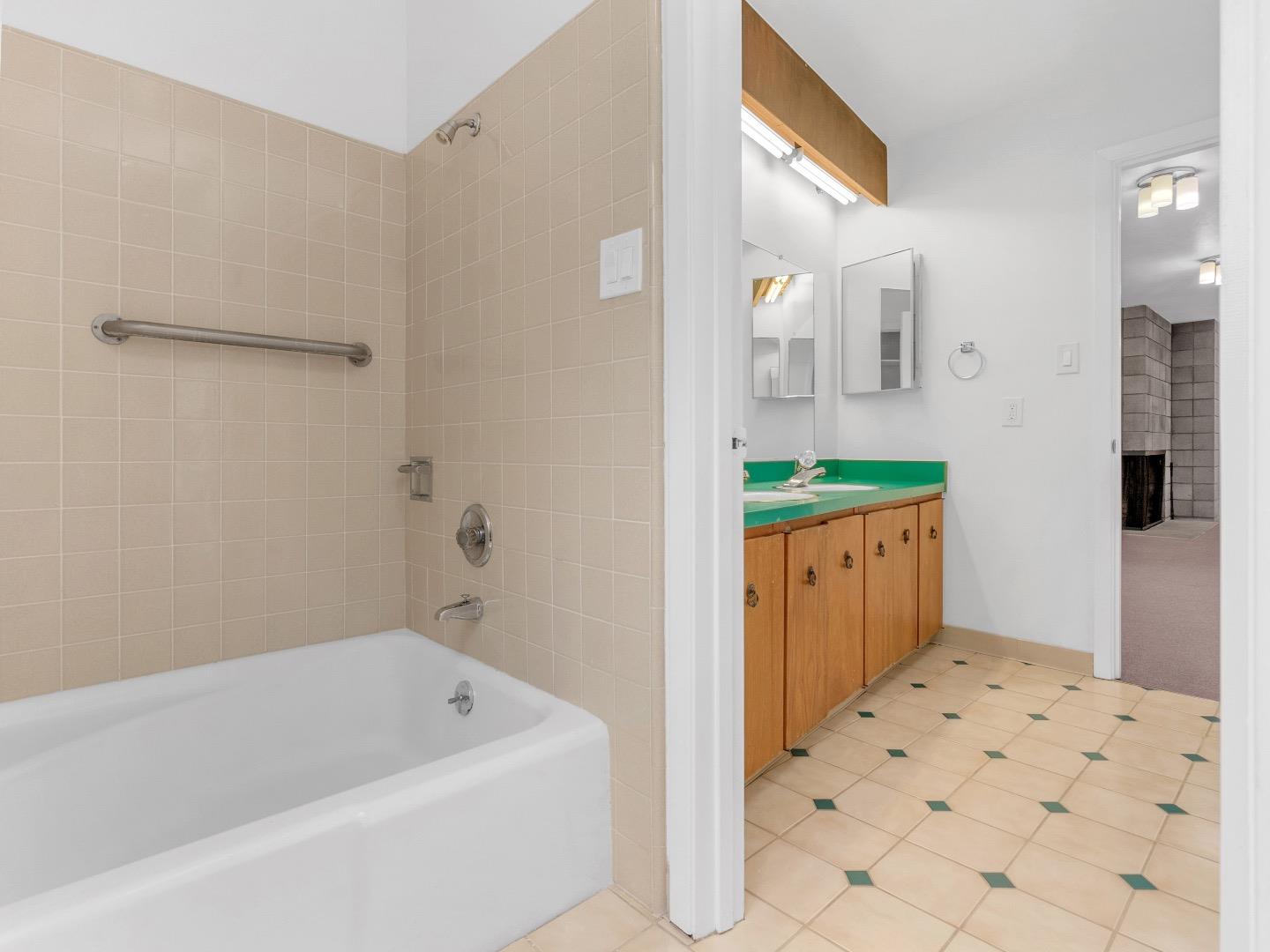 224 Olympian Way Pacifica, CA 94044 - Photo 27 of 46 a bathroom with a bathtub sink and mirror