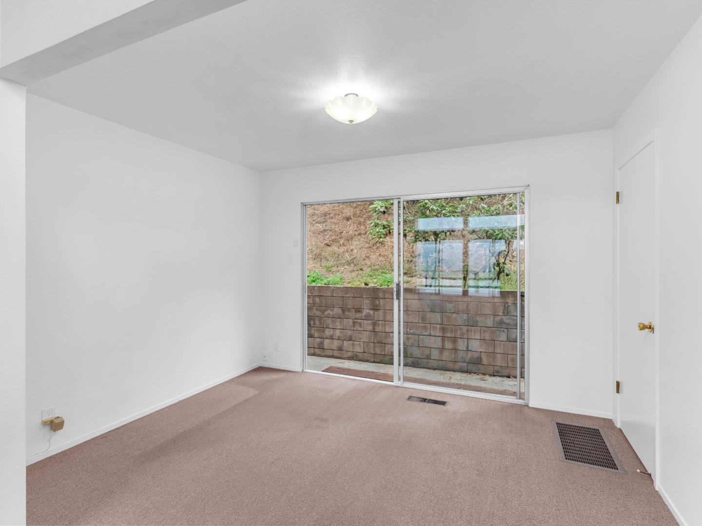 224 Olympian Way Pacifica, CA 94044 - Photo 29 of 46 a view of an empty room with glass door