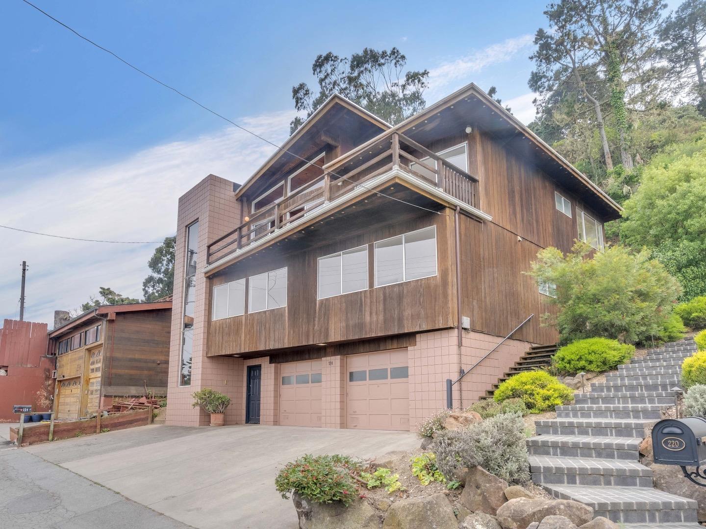 224 Olympian Way Pacifica, CA 94044 - Photo 3 of 46 a front view of a house with a yard
