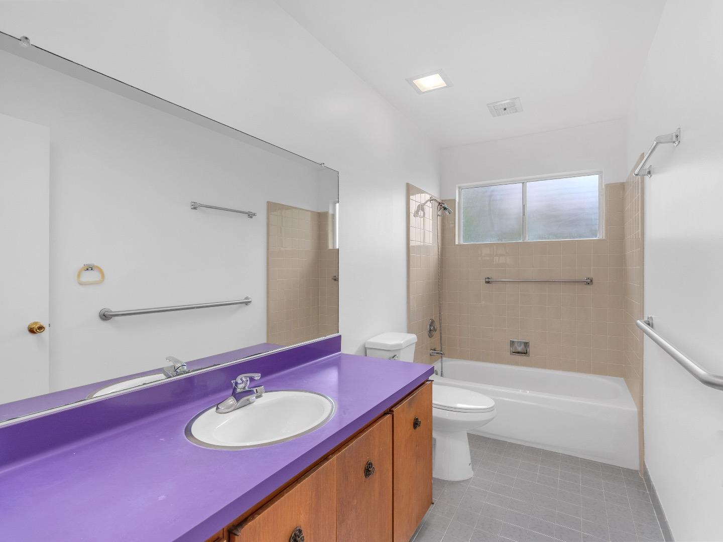 224 Olympian Way Pacifica, CA 94044 - Photo 31 of 46 a bathroom with a granite countertop sink toilet and shower