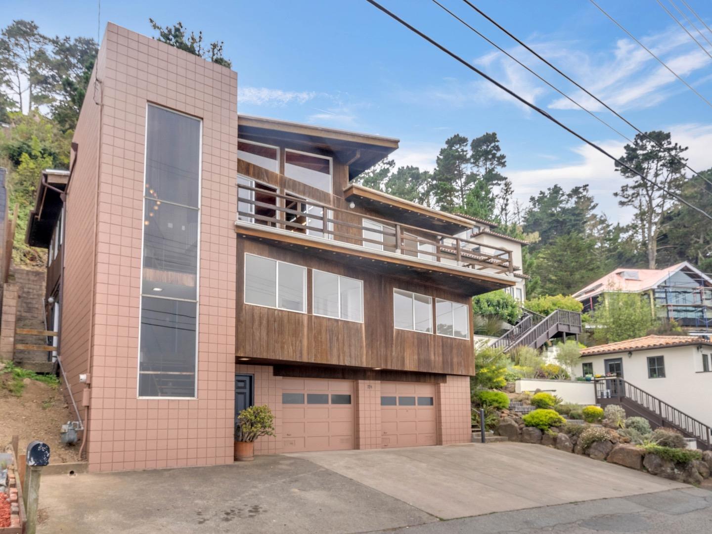 224 Olympian Way Pacifica, CA 94044 - Photo 6 of 46 a front view of a house with a garage