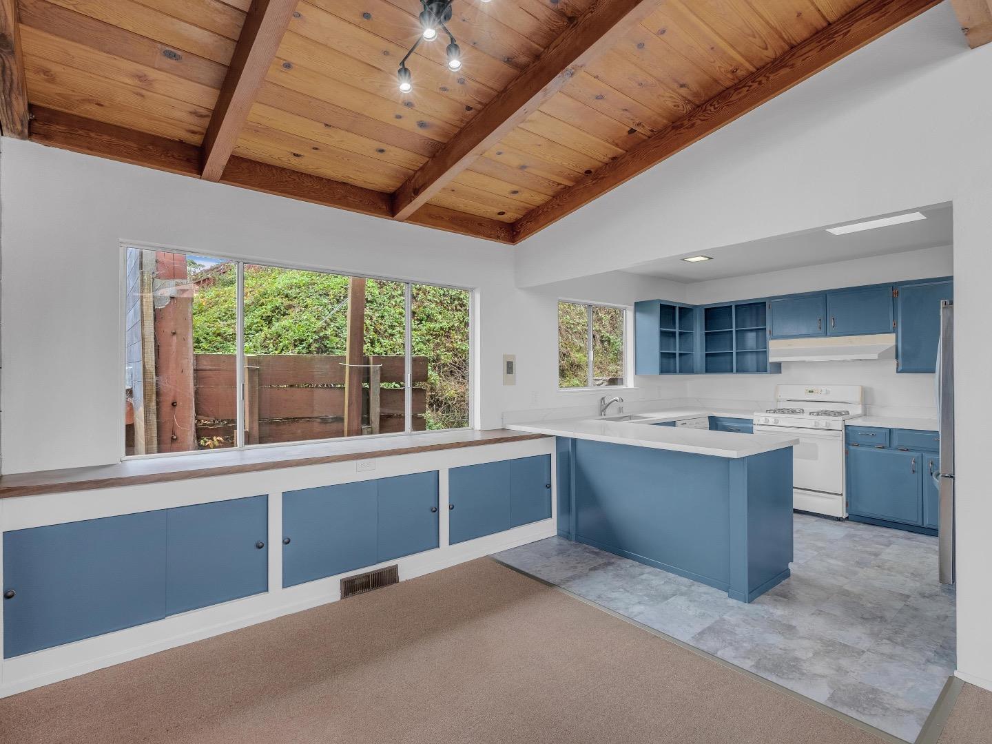 224 Olympian Way Pacifica, CA 94044 - Photo 9 of 46 a large kitchen with a large window and counter top