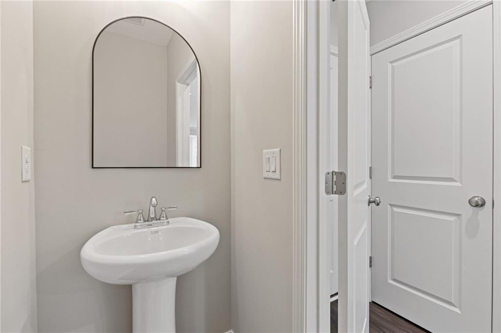2717 Rylee Carter Street Dacula, GA 30019 - Photo 11 of 29 a bathroom with a sink and a mirror