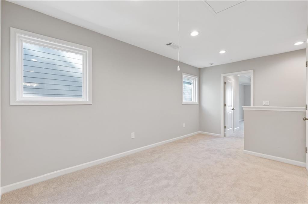 2717 Rylee Carter Street Dacula, GA 30019 - Photo 20 of 29 a view of an empty room with a window