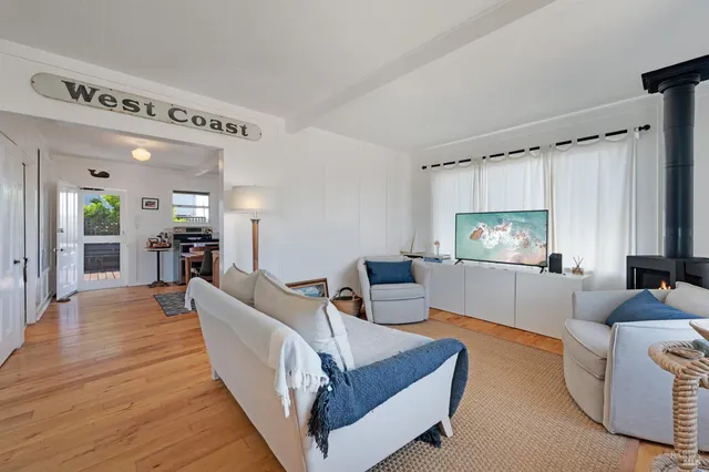 a living room with furniture and a chair