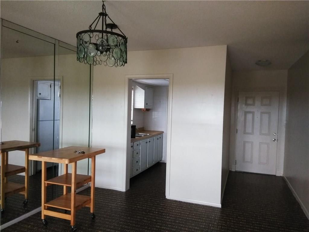 1250 East Sample Road, Unit 311 Pompano Beach, FL 33064 - Photo 8 of 13 DINING AND TWO DOOR ENTRY