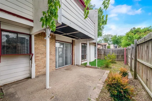 a view of a house with a small garden