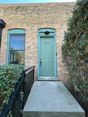a view of entryway with wooden floors