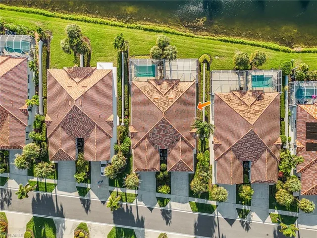 an aerial view of a house with a ocean view