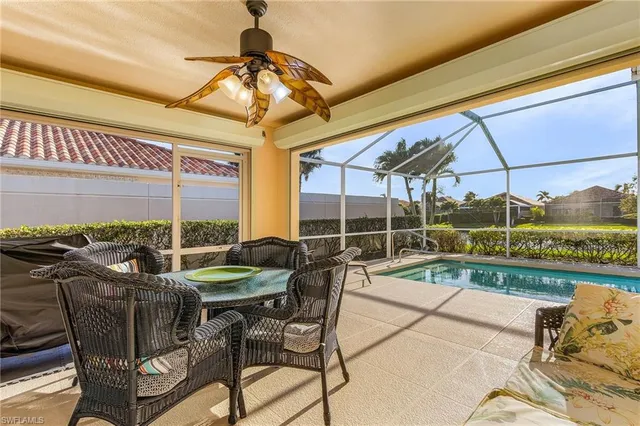 a view of a patio with a table and chairs