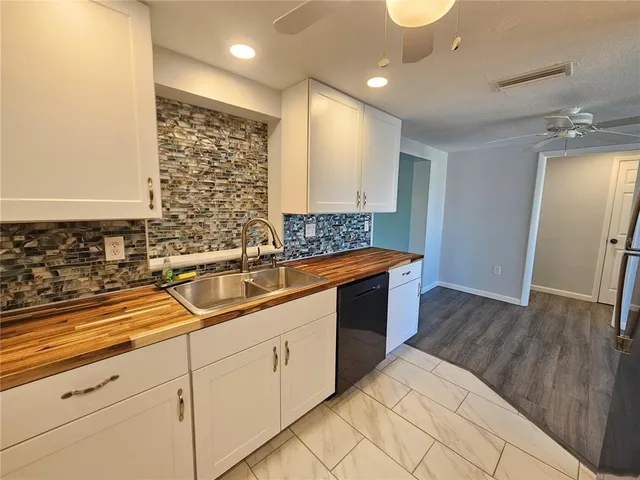 a kitchen with a sink and cabinets