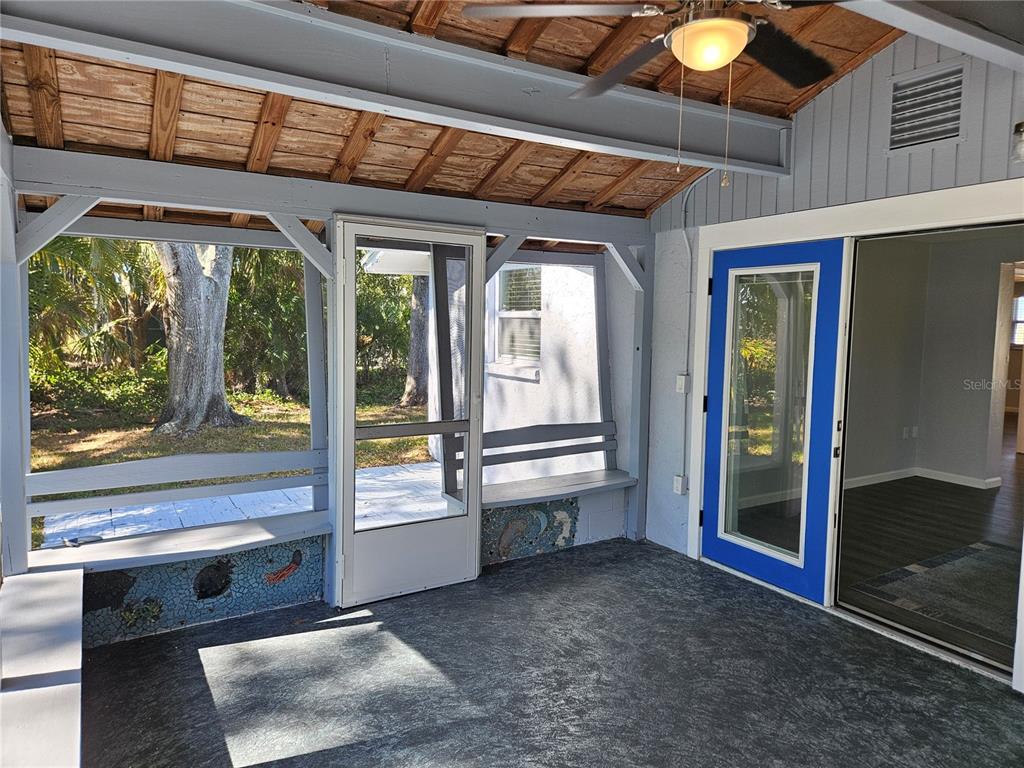 8229 Cypress Road Englewood, FL 34224 - Photo 23 of 44 a view of an entryway with a floor to ceiling window
