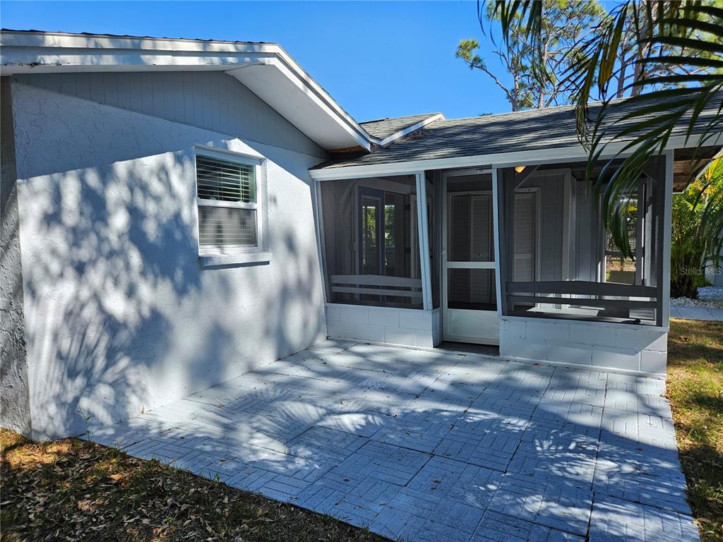 8229 Cypress Road Englewood, FL 34224 - Photo 24 of 44 a view of a house with a patio