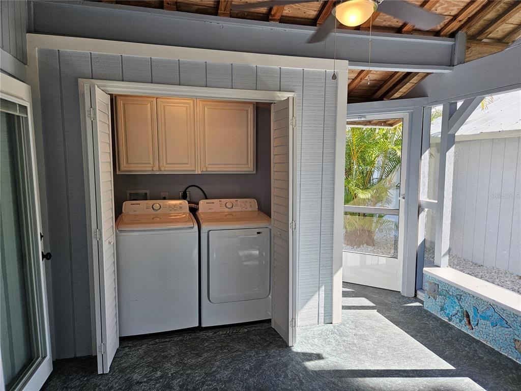 8229 Cypress Road Englewood, FL 34224 - Photo 43 of 44 a room with storage and utility